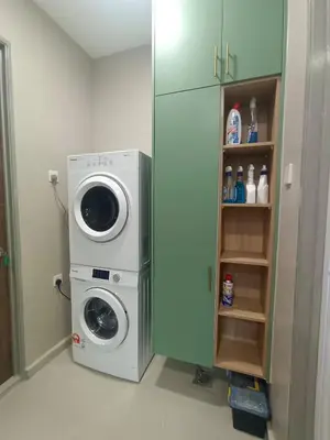 a washing machine and a washer in a room at Hejau Golf Villa in Tanah Rata