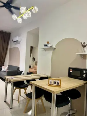 a living room with a table with a clock on it at Stay at Anderson Condo1615 Ipoh Town in Ipoh