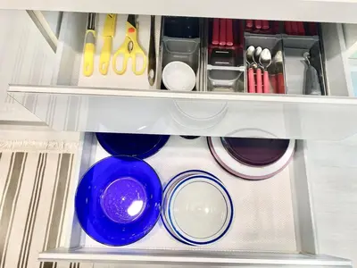 a drawer filled with plates and bowls and utensils at Straits Garden Suites #Pool with view #Seaview and bridge view #Georgetown #3pax #2BR2bath #1Queen 1Single #Quality well maintained #Private host in George Town