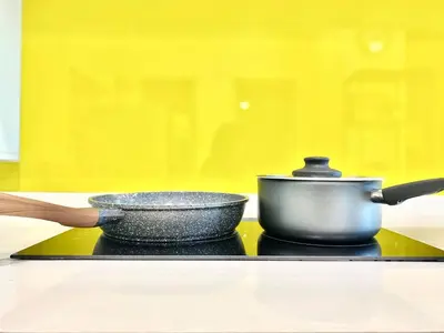 a pot and a pan on top of a stove at Straits Garden Suites #Pool with view #Seaview and bridge view #Georgetown #3pax #2BR2bath #1Queen 1Single #Quality well maintained #Private host in George Town