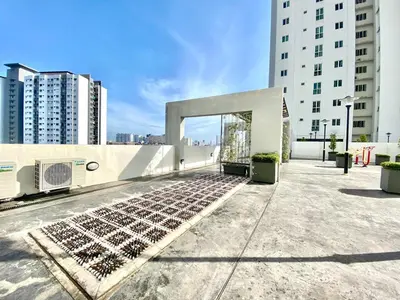 a building with a bunch of solar panels on the roof at Straits Garden Suites #Pool with view #Seaview and bridge view #Georgetown #3pax #2BR2bath #1Queen 1Single #Quality well maintained #Private host in George Town