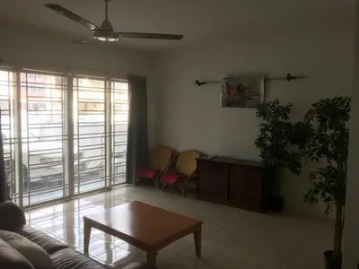 a living room with a couch and a table at Batu Kawan HS in Simpang Ampat
