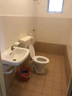 a bathroom with a toilet and a sink at Batu Kawan HS in Simpang Ampat