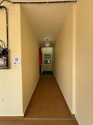 a hallway leading to a kitchen in a room at Heartstay Tanjong Karang \u598d\u83c1\u540d\u5bbf in Kampong Tanjong Karang