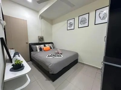 a bedroom with a bed in a room at Specious Living Cozy House in Bukit Mertajam