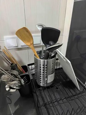 a basket of utensils sitting on top of an oven at 16 pax HB Homestay Raja Uda Ong Yi How Butterworth - Budget Homestay - KTV NETFLIX MAHJONG in Butterworth