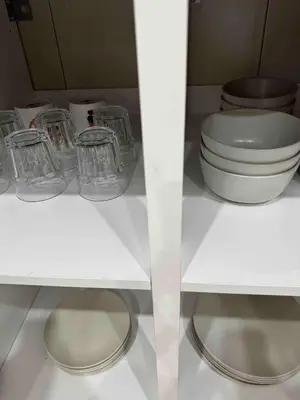 a bathroom with a toilet and glasses on a shelf at 16 pax HB Homestay Raja Uda Ong Yi How Butterworth - Budget Homestay - KTV NETFLIX MAHJONG in Butterworth