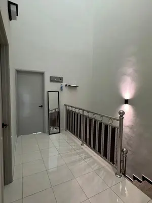 a hallway with a staircase with a door and a tile floor at 16 pax HB Homestay Raja Uda Ong Yi How Butterworth - Budget Homestay - KTV NETFLIX MAHJONG in Butterworth