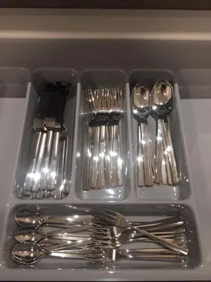 a tray of silver utensils in a drawer at By the Sea PENTHOUSE duplex in Batu Ferringhi