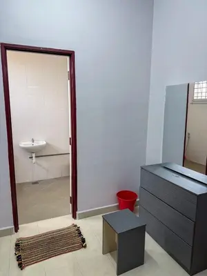 a bathroom with a sink and a mirror and a door at M S Villa Homestay Ayer Tawar in Ayer Tawar