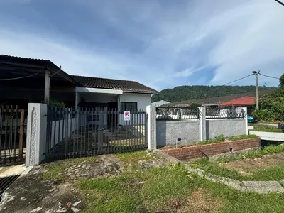 a white fence in front of a house at Rumah Bonda in Gua Sai