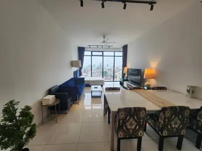 a living room with a couch and a table at Beacon Executive Suite Penang George Town in George Town