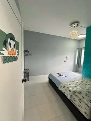 a bedroom with a bed and a sign on the wall at Love Mickey Cameron Highlands in Cameron Highlands