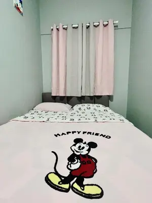 a bed with a mickey trump sticker on it at Love Mickey Cameron Highlands in Cameron Highlands