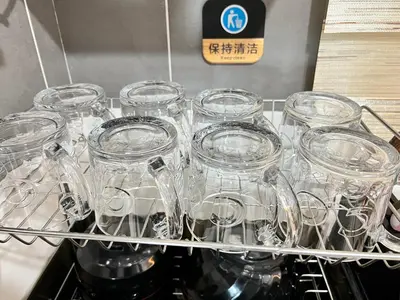 a bunch of glass jars sitting on a shelf at Love Mickey Cameron Highlands in Cameron Highlands