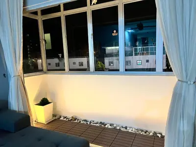 a room with a window with a ship outside at Love Mickey Cameron Highlands in Cameron Highlands