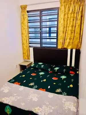 a bedroom with a bed and a window with yellow curtains at Golden Bright Future Trading in Tanah Rata