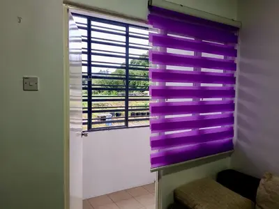 a window with purple blinds in a room at Golden Bright Future Trading in Tanah Rata