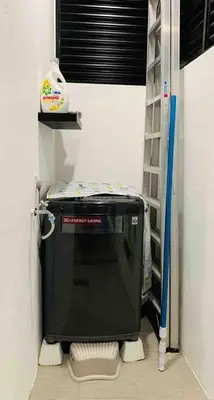 a small refrigerator in a room with a shelf at Love birds Abbie's Private Pool Villa 2 pax in Bukit Mertajam