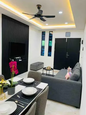 a living room with a couch and a table at Love birds Abbie's Private Pool Villa 2 pax in Bukit Mertajam
