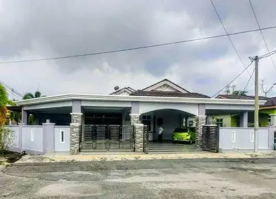 a house with a car parked in front of it at 18pax Bungalow Homestay Hutan Melintang in Hutan Melintang