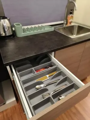 a drawer in a kitchen with utensils in it at JJ's Modern Suite Kampar- Near UTAR in Kampar