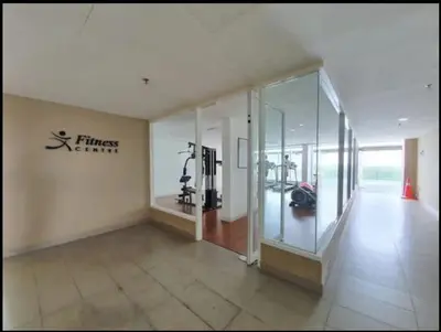 a gym with a fitness institute sign on the wall at JJ's Modern Suite Kampar- Near UTAR in Kampar