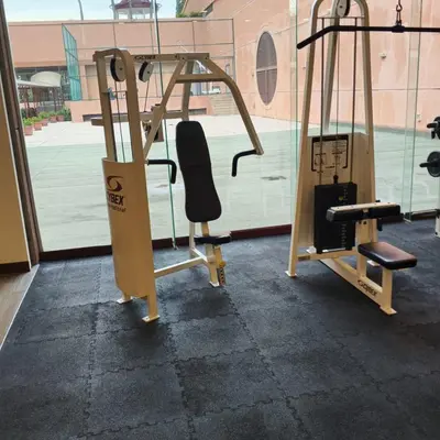 a gym with a bench and a swing at Kuala Lumpur Residence At Hotel Times square in Gua Sai