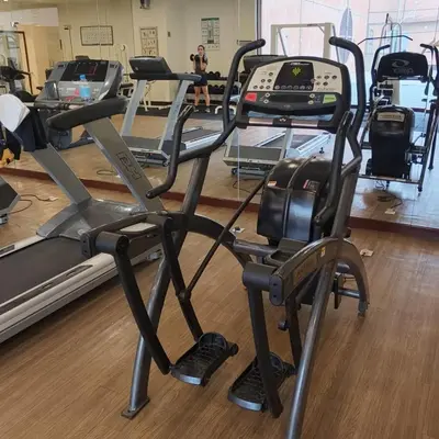 a gym with several tread machines in a room at Kuala Lumpur Residence At Hotel Times square in Gua Sai