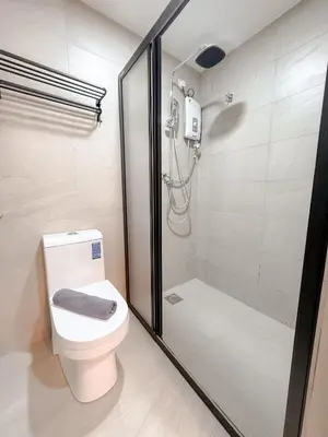a bathroom with a toilet and a shower at Resandau Stay Ipoh - Nearby Ipoh Town - Private Car Park and Lift - Whole unit & Coliving in Ipoh