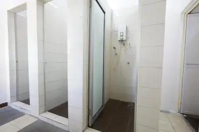 a shower stall with a glass door in a bathroom at Ros Heritage Motel in George Town
