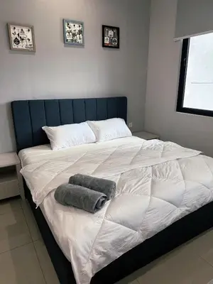 a large bed with two pillows on top of it at Wanderlust Retreat Studio by Iconic Regency in Bayan Lepas