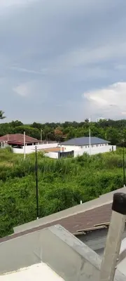 a view of a skate park with buildings and grass at Untung5tay in Gua Sai