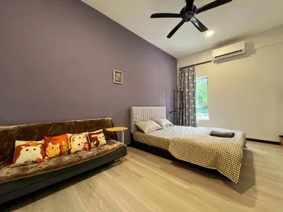 a bedroom with a bed and a couch at Modern Casual Style Haus 4Room`````Alma in Bukit Mertajam