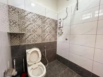 a bathroom with a toilet and a shower at Modern Casual Style Haus 4Room`````Alma in Bukit Mertajam