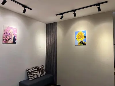 a room with three paintings on the wall at Modern Casual Style Haus 4Room`````Alma in Bukit Mertajam