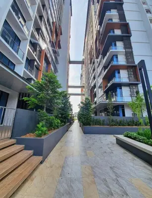 a walkway in a city with tall buildings at #2 Hann's Residence Homestay Sunset View 2R2B in Gua Sai