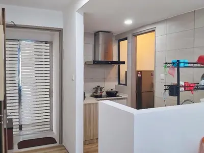a kitchen with a large window and a kitchen with a counter at #2 Hann's Residence Homestay Sunset View 2R2B in Gua Sai