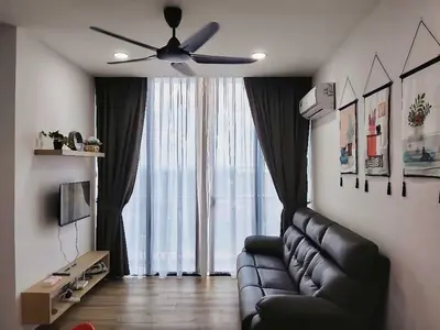 a living room with a couch and a ceiling fan at #2 Hann's Residence Homestay Sunset View 2R2B in Gua Sai