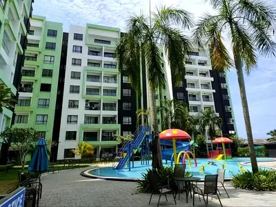 a playground in front of a apartment building at Ipoh Manhattan Waterpark Suite by City Home Empire MHA306 in Ipoh