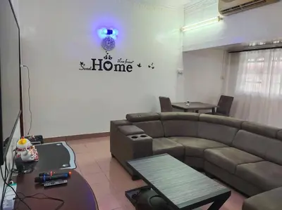 a living room with a couch and a table at Y.s.a Homestay(100mbps Wifi) in Ipoh