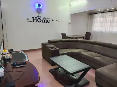a living room with a couch and a table at Y.s.a Homestay(100mbps Wifi) in Ipoh