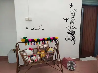 a basket with toys and birds on a wall at Y.s.a Homestay(100mbps Wifi) in Ipoh