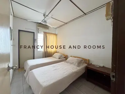 two beds in a room with a sign that reads fancy house and rooms at Nanyang Style Home In Ipoh in Ipoh
