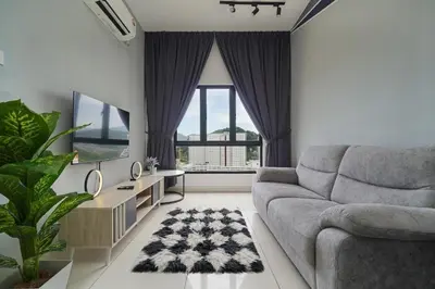 a living room with a couch and a large window at L13 Cozy Corner The Horizon Ipoh in Ipoh