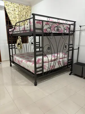 a couple of bunk beds in a room at Bidor Homestay in Bidur