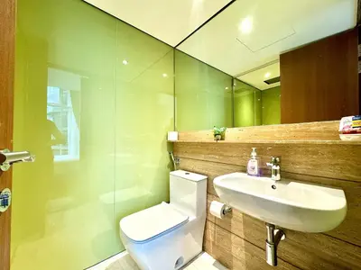 a bathroom with a white toilet and a sink at Sky Suites Peaches 2BR Nearby KLCC in Gua Sai