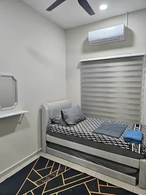 a large bed in a room with a tv at Adam Homestay in Gua Sai