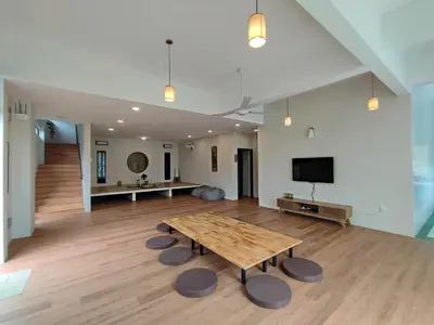 a large room with a wooden table and a tv at Sunya Home Basement Raub Pahang in Raub