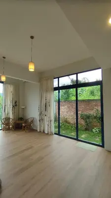 an empty living room with a large glass window at Sunya Home Basement Raub Pahang in Raub